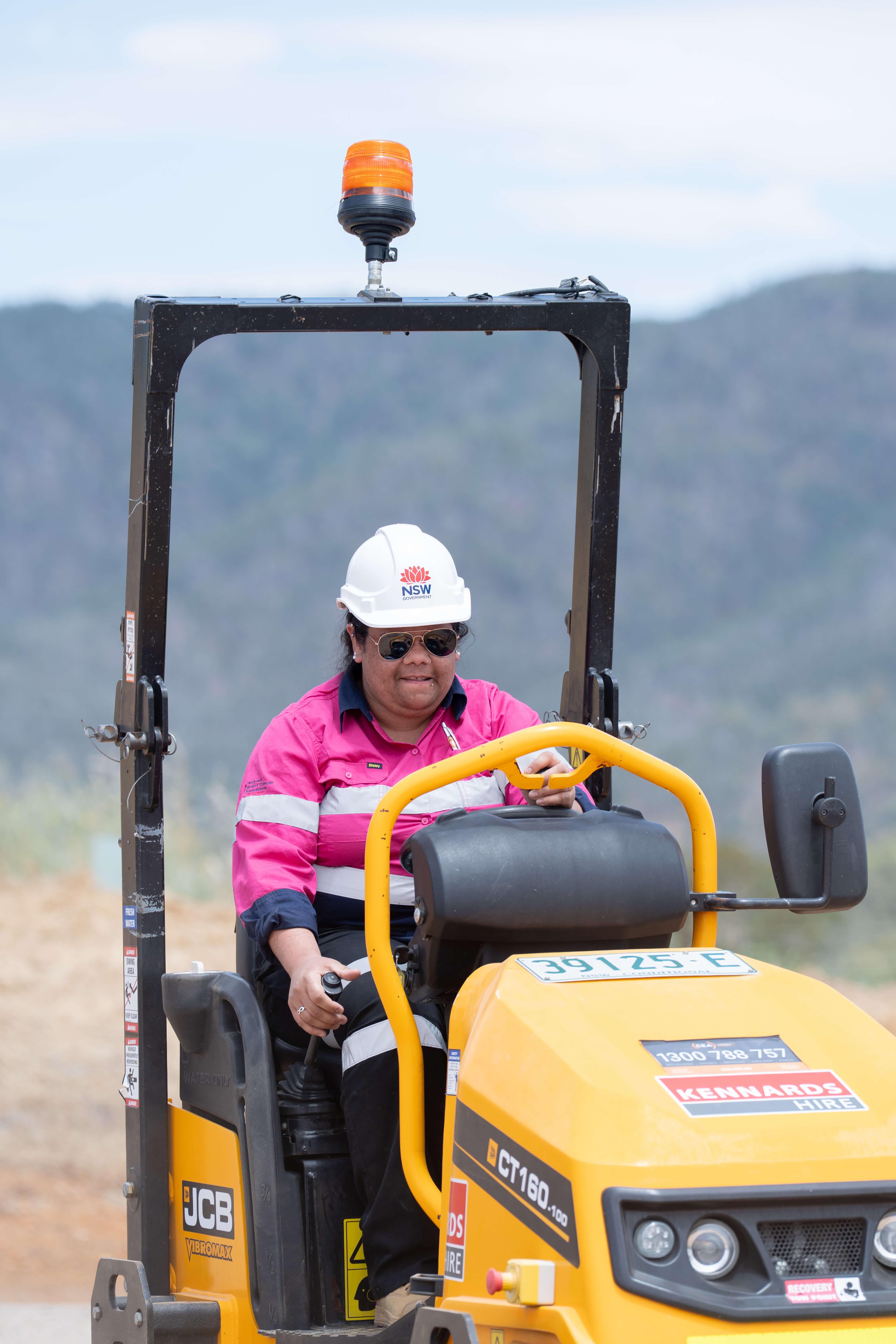 Image of a woman on a tractor in regional NSW